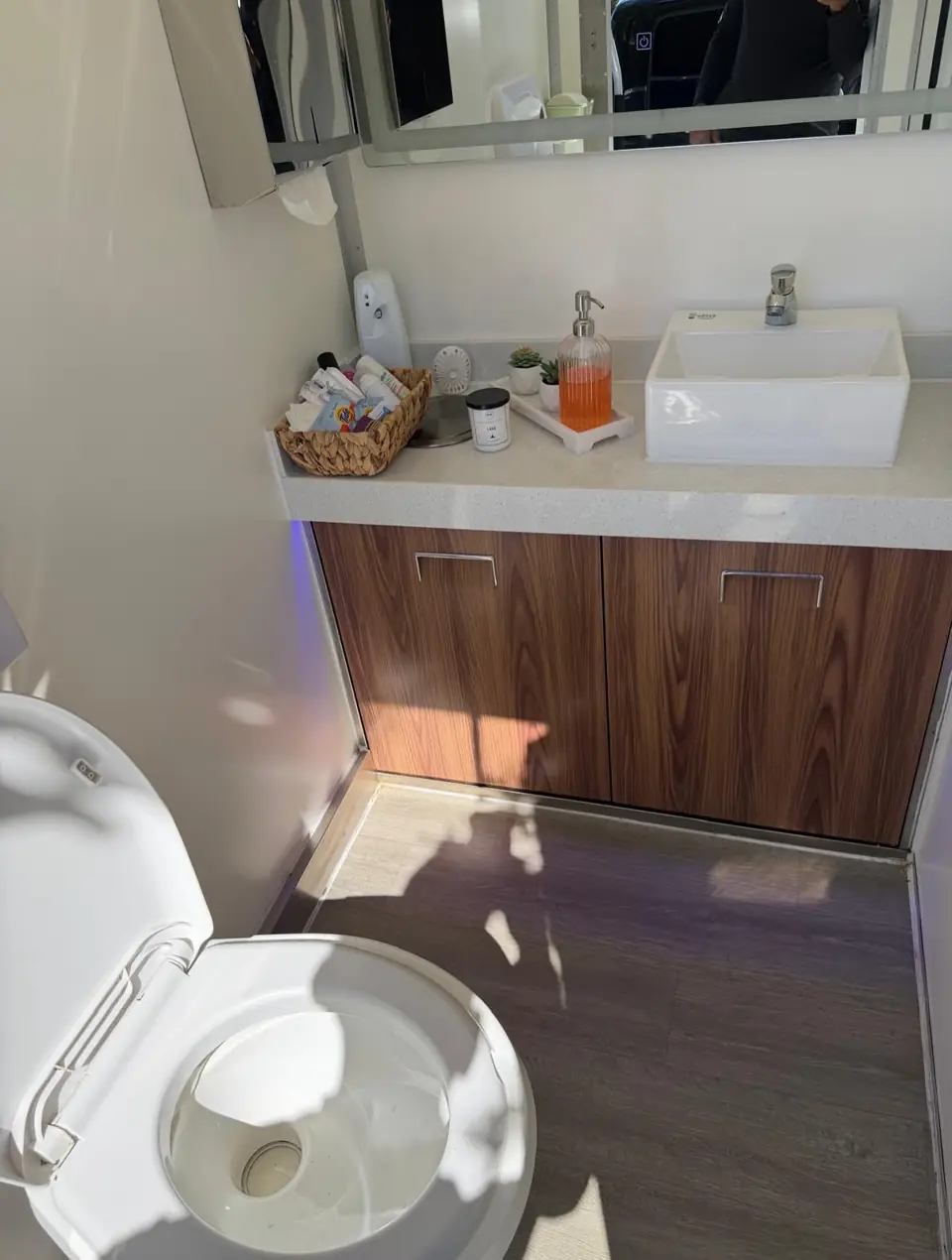 Restroom trailer vanity with vessel sink and soap
